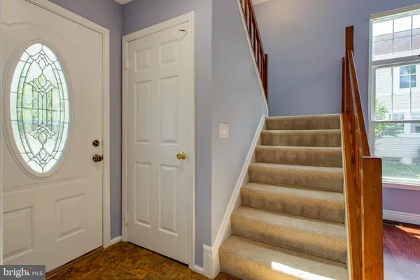 a view of an entryway with wooden floor