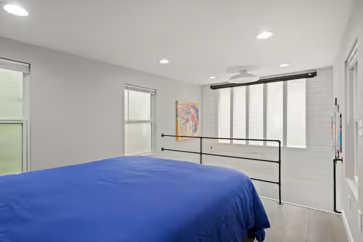 307 East 35th Street, Unit A Austin, TX 78705 - Photo 35 of 40 Recessed lighting and ample natural light illuminate this well-appointed bedroom.