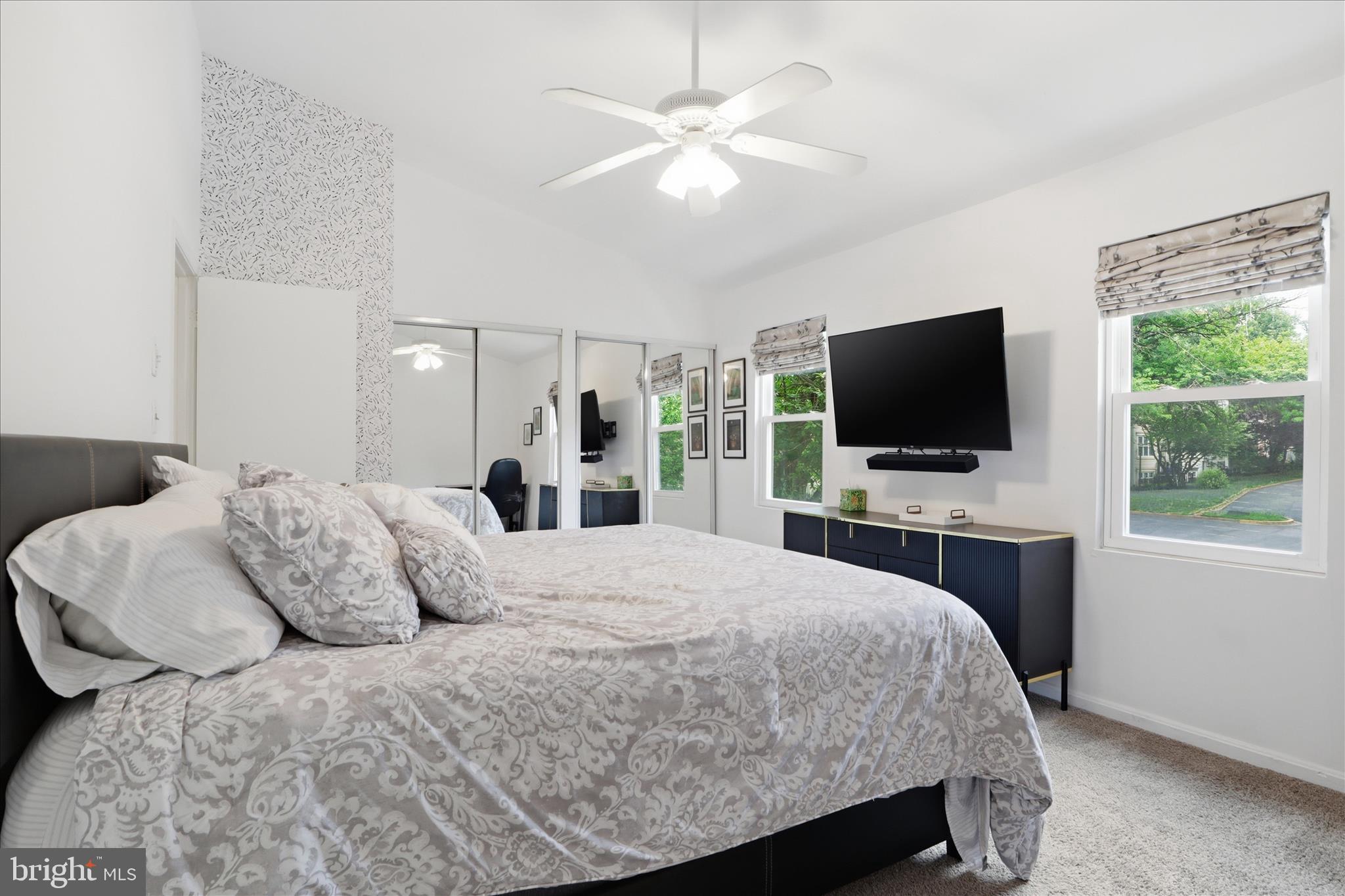 71 Kinsman View Circle Silver Spring, MD 20901 - Photo 18 of 42 a bedroom with a bed and a flat screen tv