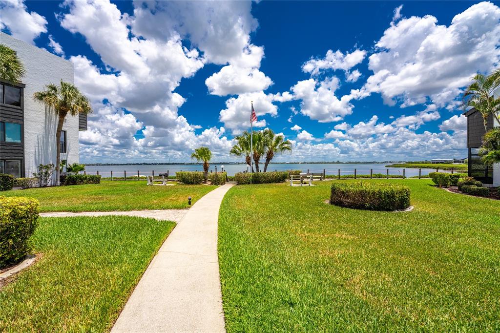 2955 North Beach Road, Unit B614 Englewood, FL 34223 - Photo 41 of 67 a view of a swimming pool is middle in the garden