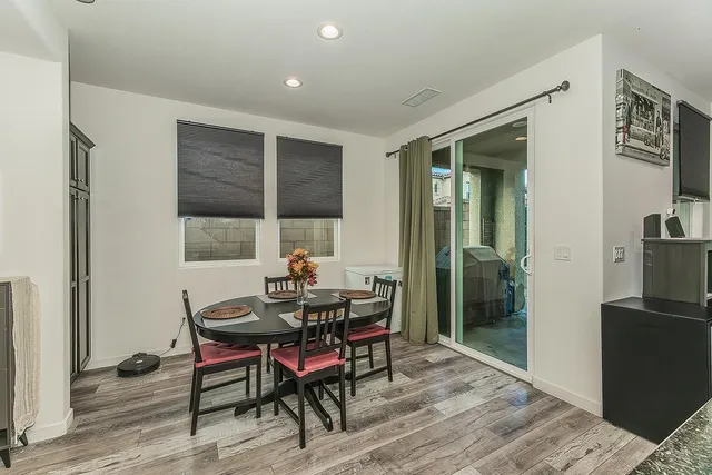 a view of a dining room with furniture and window