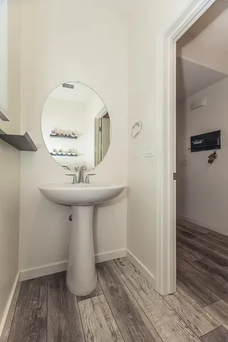 a bathroom with a sink and a mirror