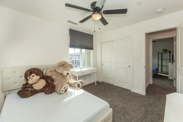 a room with a bed and a chandelier