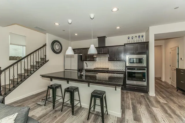 a kitchen with a table and chairs in it