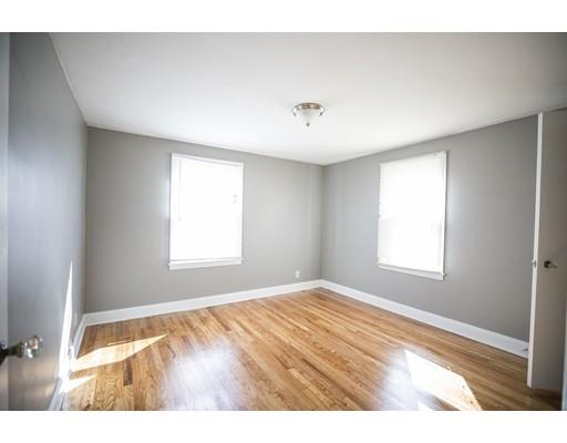 302 Island Pond Road Springfield, MA 01118 - Photo 11 of 25 a view of an empty room with a window