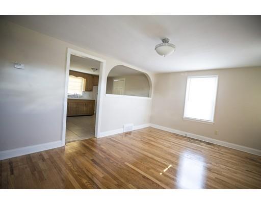 302 Island Pond Road Springfield, MA 01118 - Photo 5 of 25 a view of an empty room and window