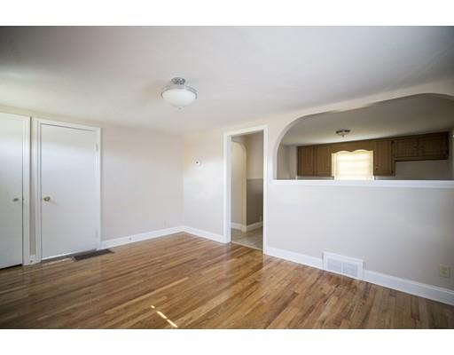 302 Island Pond Road Springfield, MA 01118 - Photo 6 of 25 a view of an empty room and wooden floor