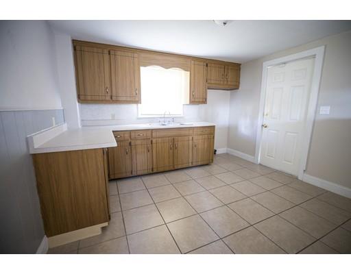302 Island Pond Road Springfield, MA 01118 - Photo 9 of 25 a kitchen with granite countertop a sink cabinets and granite counter tops