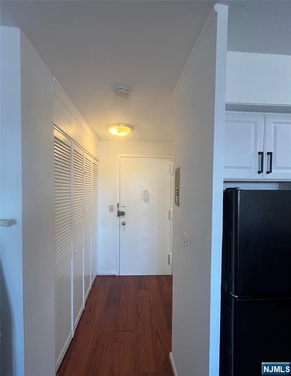 265 Main Street, Unit 506 Ridgefield Park, NJ 07660 - Photo 3 of 8 a view of hallway with wooden floor