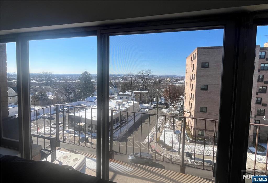 265 Main Street, Unit 506 Ridgefield Park, NJ 07660 - Photo 6 of 8 a view of a glass door with a view of the balcony