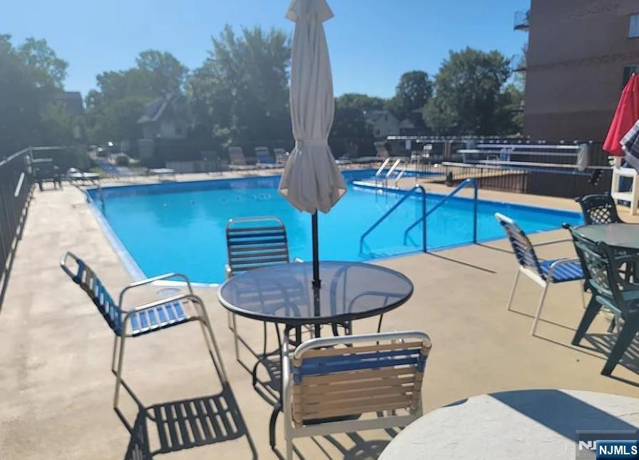 265 Main Street, Unit 506 Ridgefield Park, NJ 07660 - Photo 7 of 8 a view of a chairs and tables in the patio
