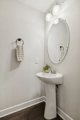 a bathroom with a sink a mirror and vanity