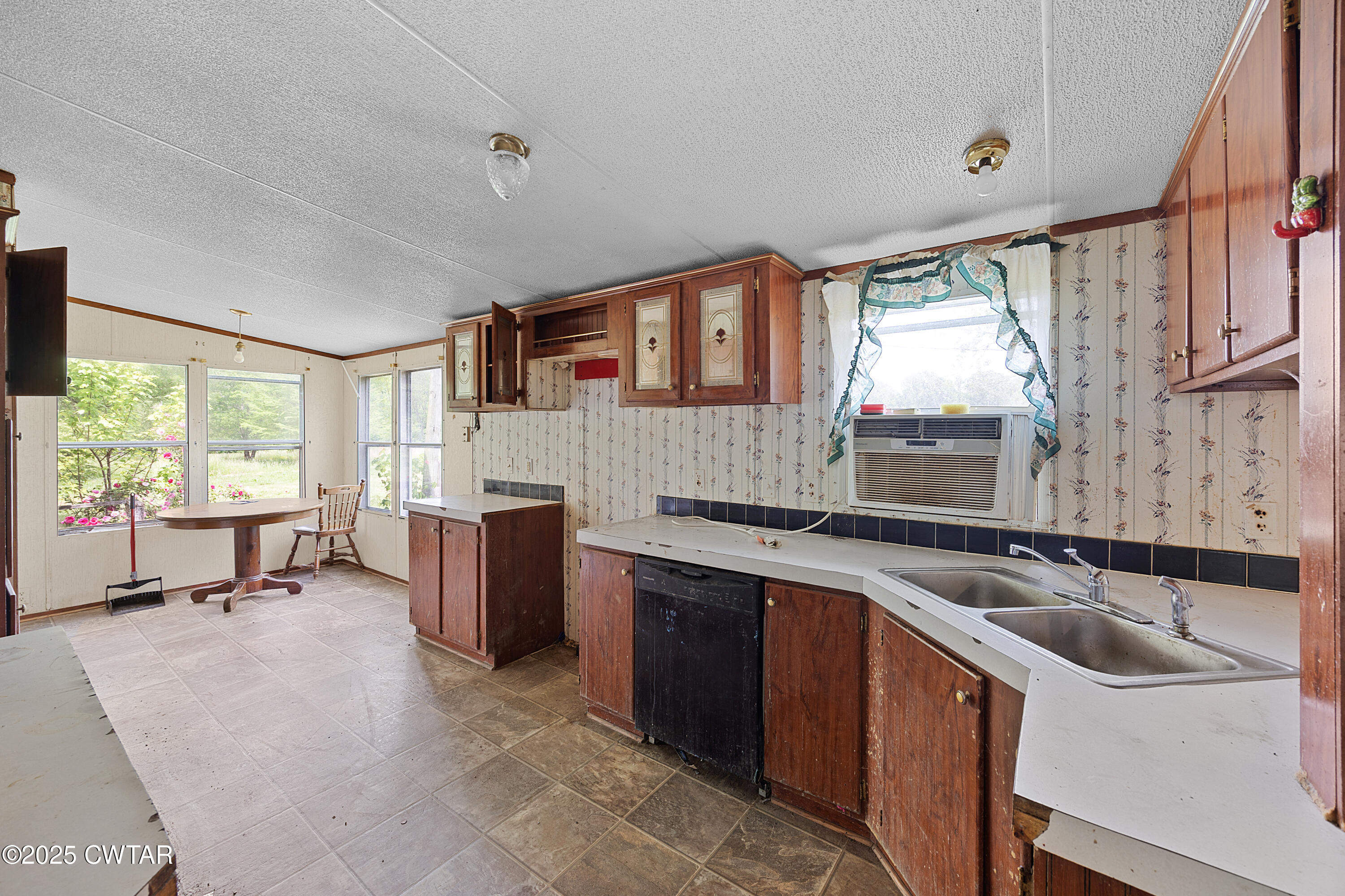 713 Caudle Store Road Greenfield, TN 38230 - Photo 16 of 28 a kitchen with a sink stove and cabinets