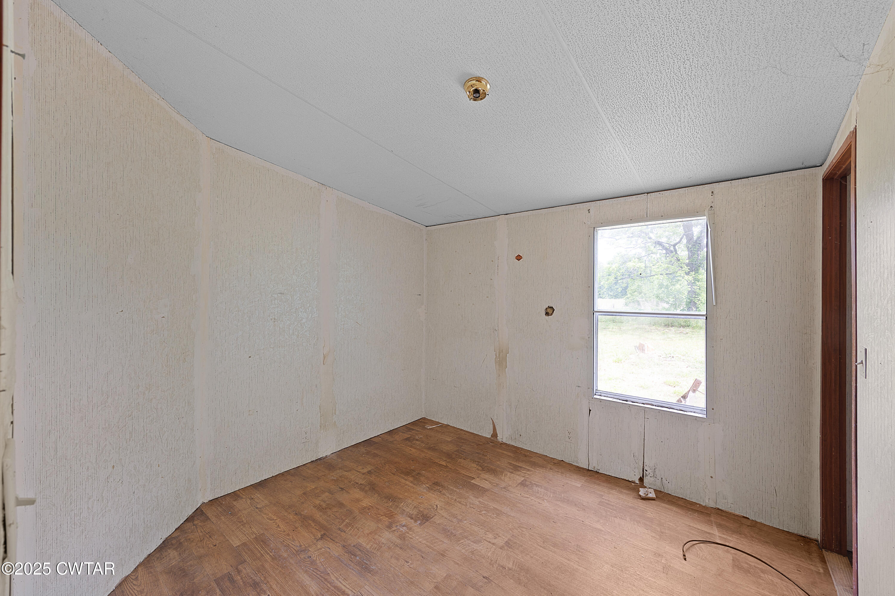 713 Caudle Store Road Greenfield, TN 38230 - Photo 17 of 28 a view of empty room with window