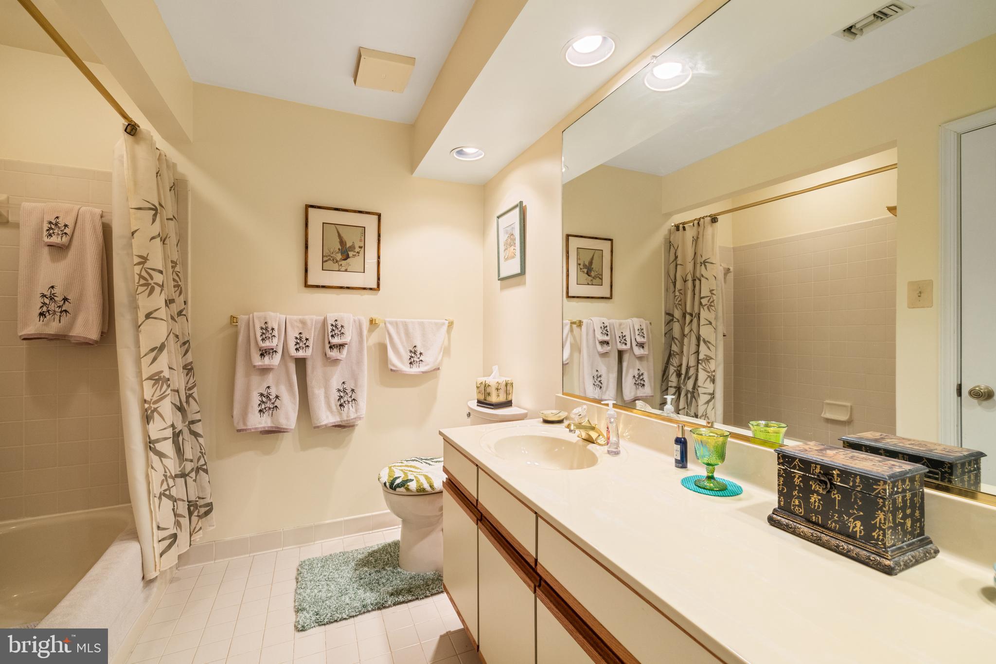 2702 Summerview Way, Unit 303 Annapolis, MD 21401 - Photo 21 of 35 a bathroom with a sink double vanity and a mirror
