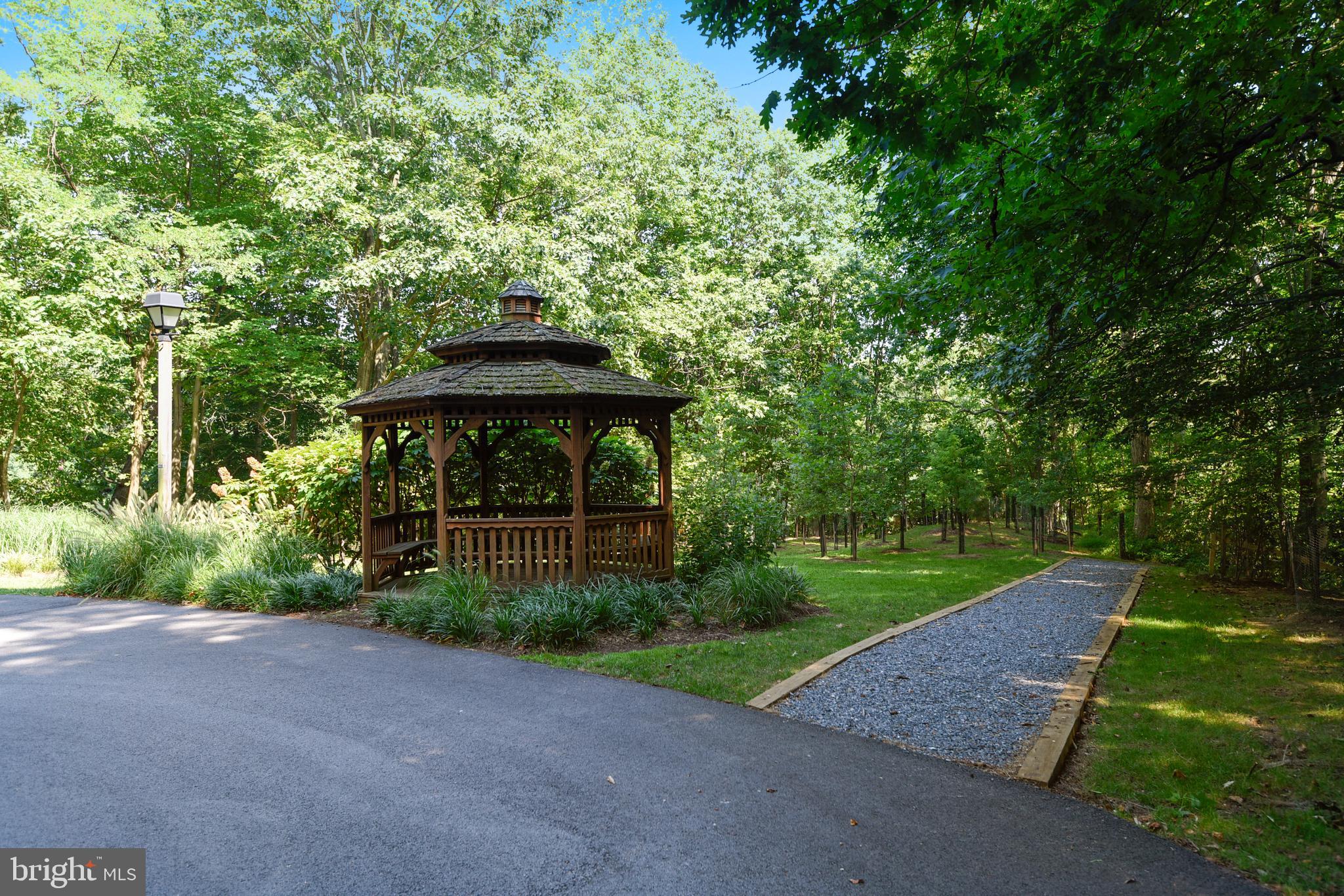 2702 Summerview Way, Unit 303 Annapolis, MD 21401 - Photo 24 of 35 a front view of a house with garden