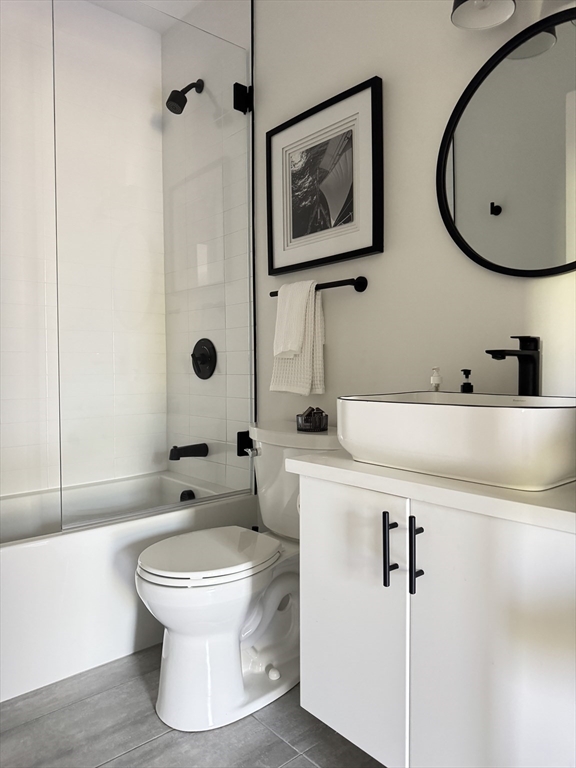 347 Maverick Street, Unit 5 Boston, MA 02128 - Photo 14 of 15 a bathroom with a toilet sink and mirror