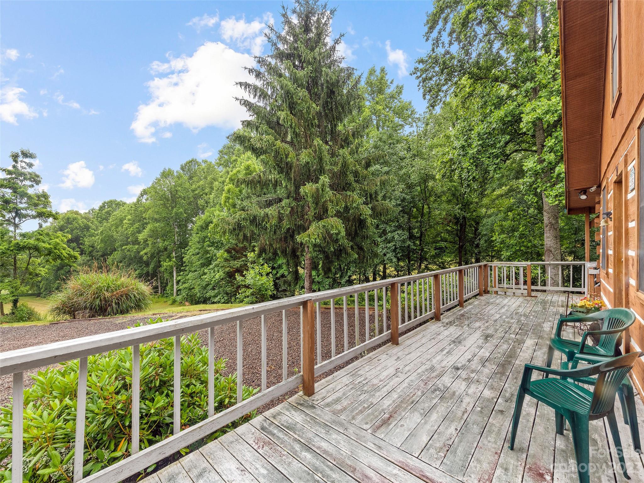 205 Columbus Cove Road Waynesville, NC 28785 - Photo 8 of 33 a view of balcony with wooden floor and fence