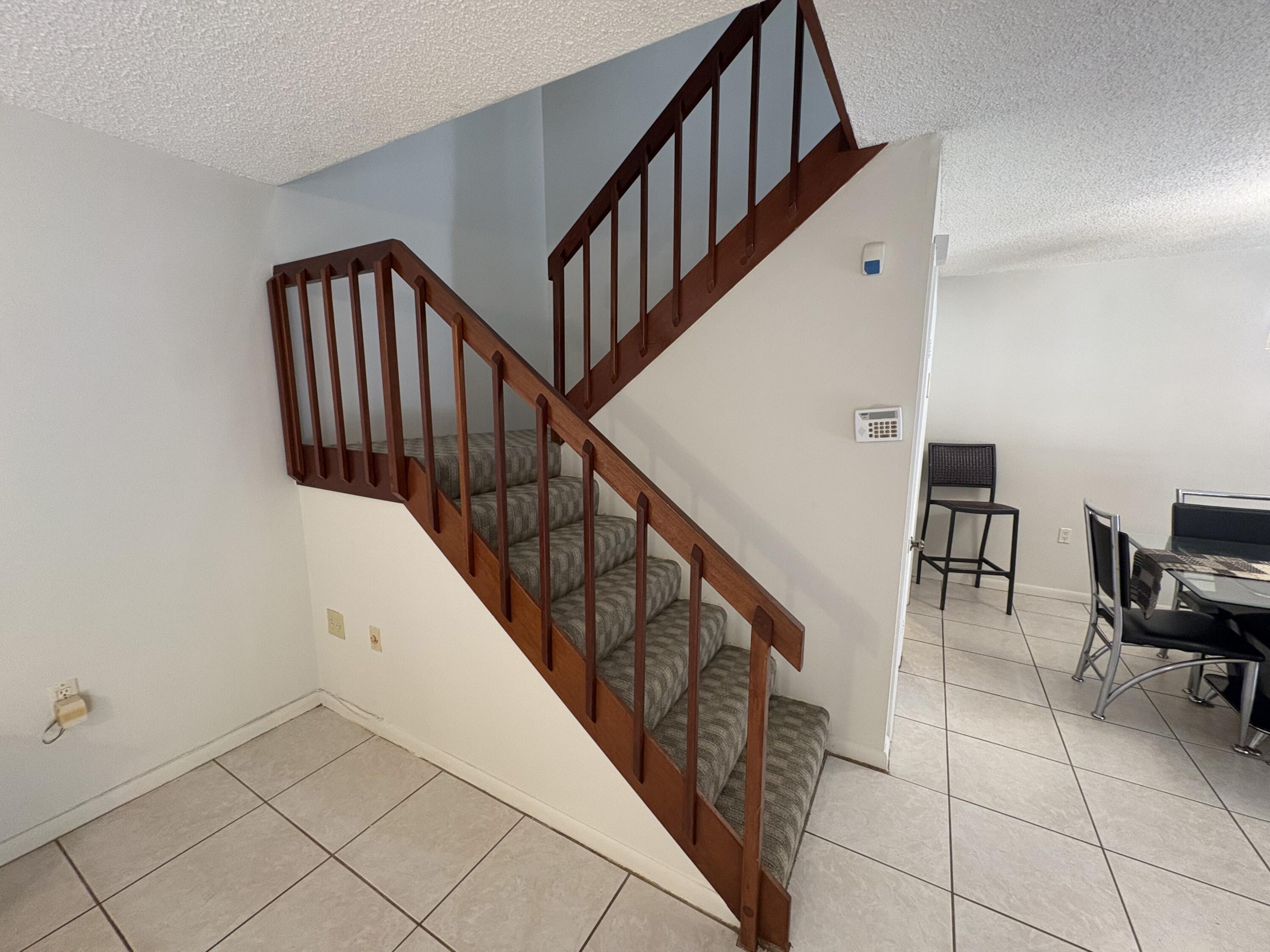 2950 Southwest 22nd Circle, Unit 4A Delray Beach, FL 33445 - Photo 15 of 42 a view of entryway and hall