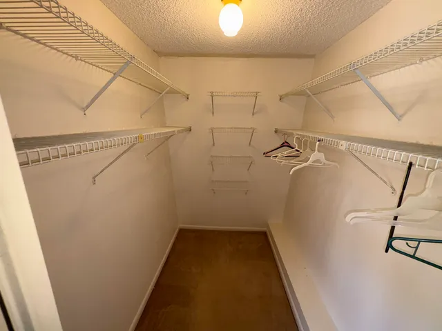 a view of a wooden deck with a yard