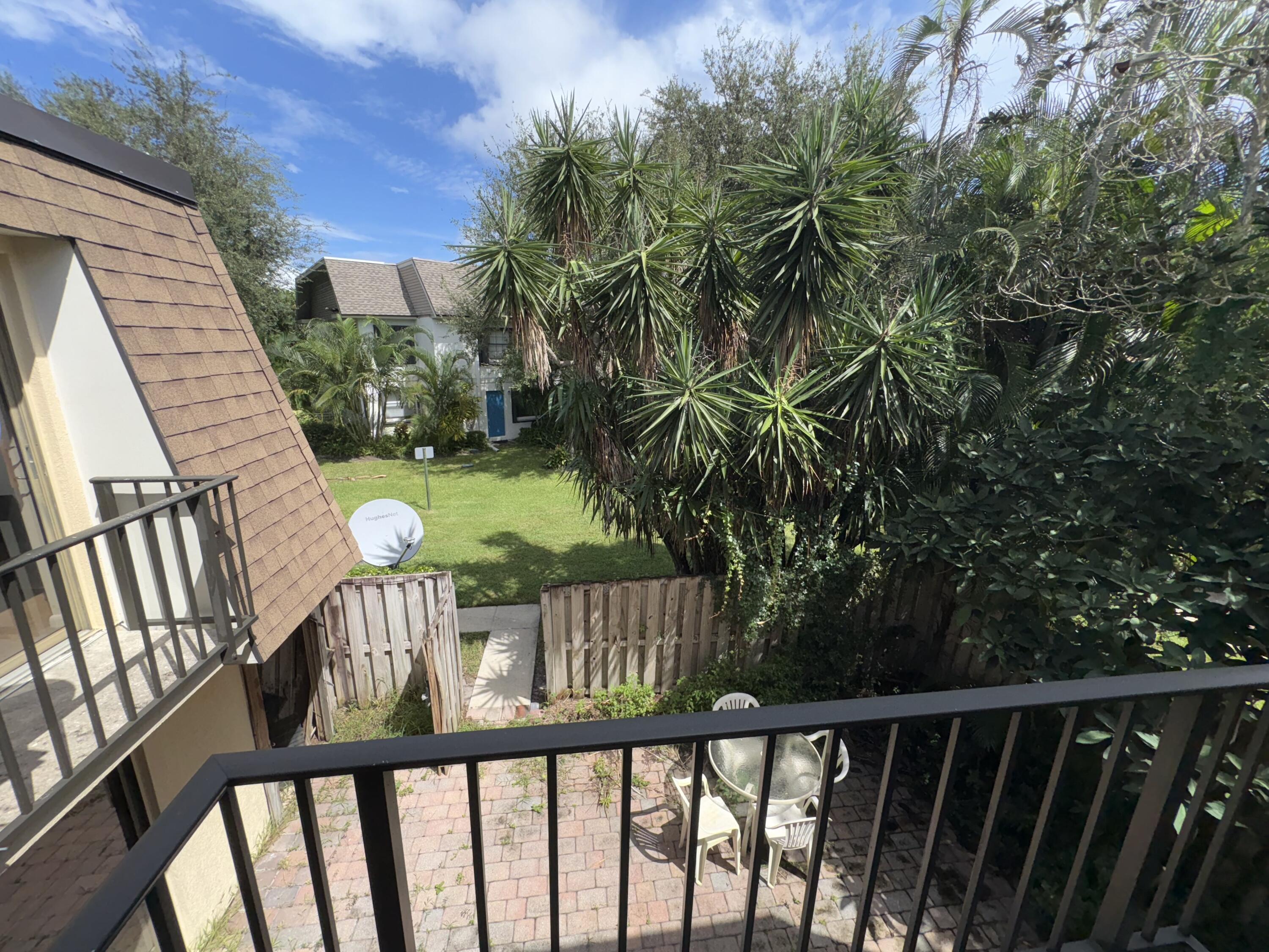 2950 Southwest 22nd Circle, Unit 4A Delray Beach, FL 33445 - Photo 22 of 42 a view of a wooden deck with a yard