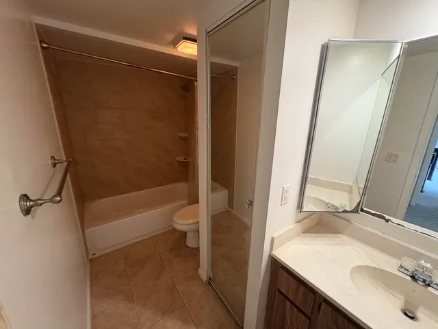 a view of backyard with deck and outdoor seating