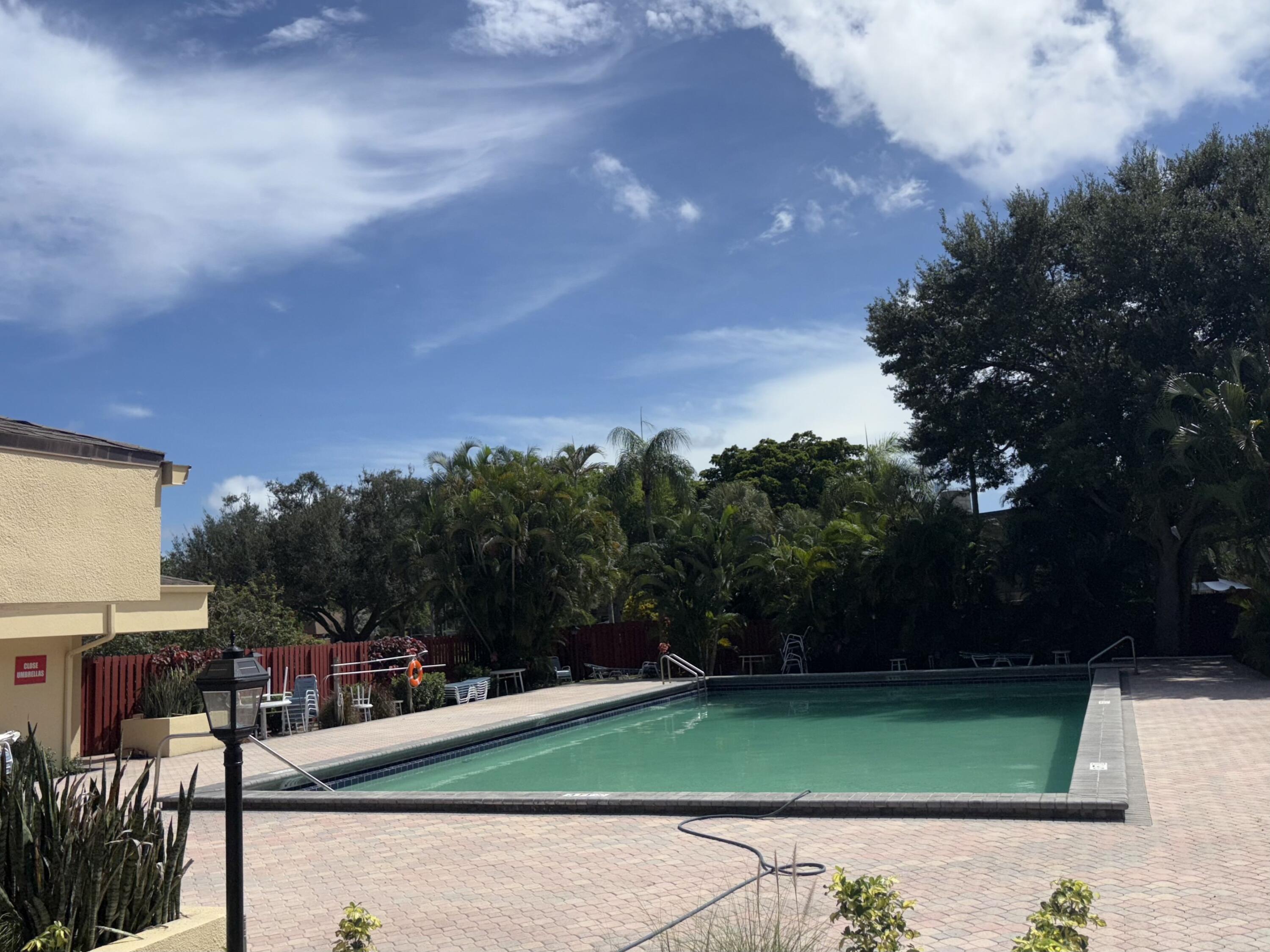 2950 Southwest 22nd Circle, Unit 4A Delray Beach, FL 33445 - Photo 30 of 42 a view of a backyard