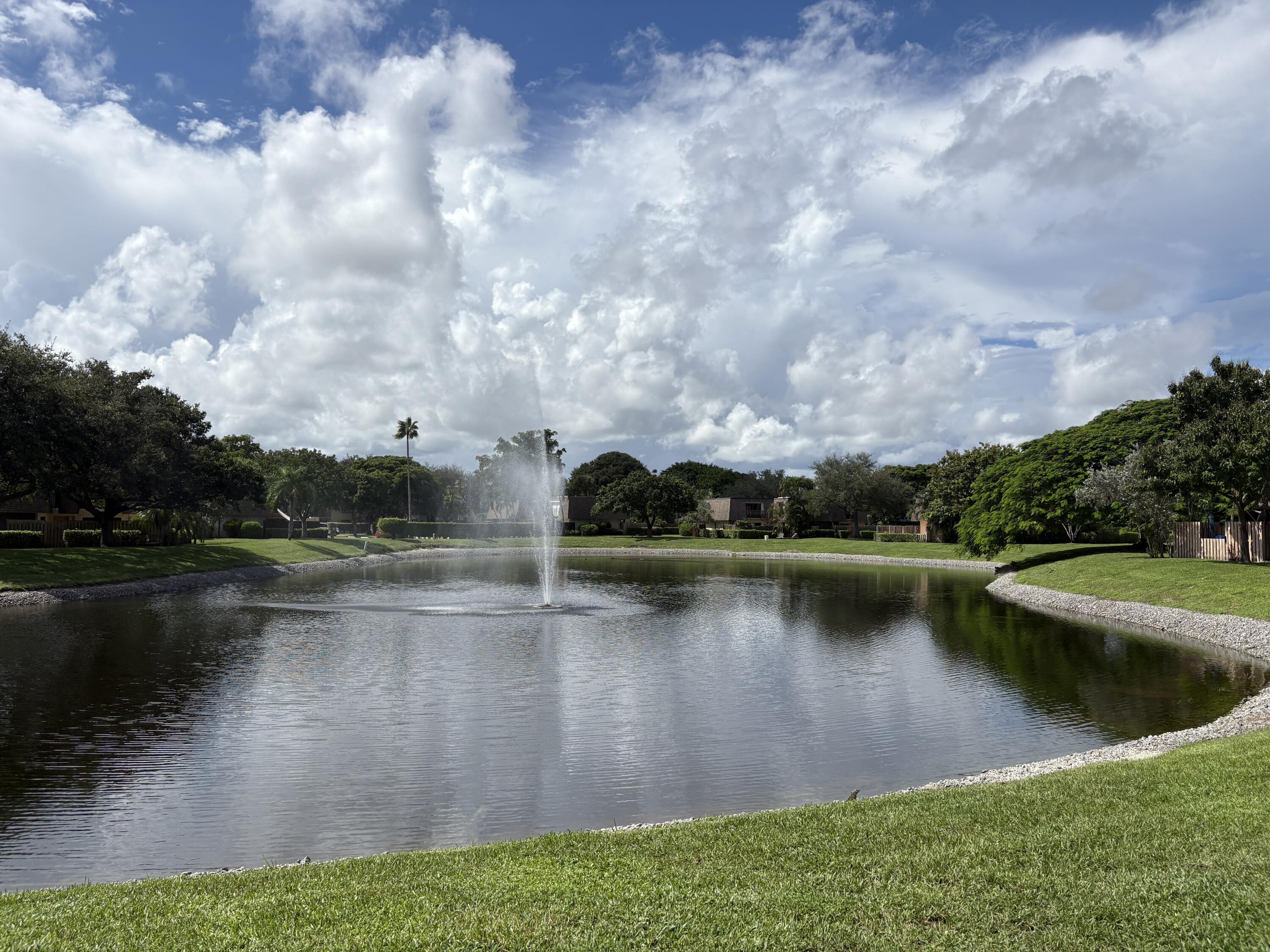2950 Southwest 22nd Circle, Unit 4A Delray Beach, FL 33445 - Photo 36 of 42 an aerial view of residential houses with outdoor space and lake view