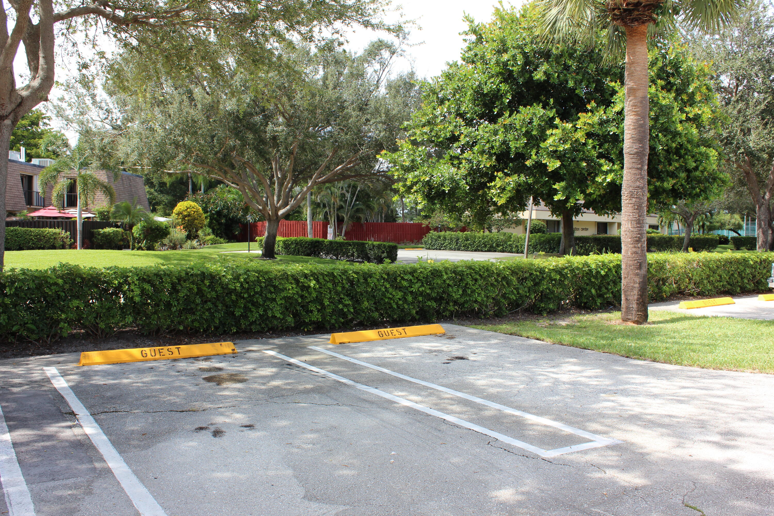 2950 Southwest 22nd Circle, Unit 4A Delray Beach, FL 33445 - Photo 38 of 42 a view of backyard with swimming pool and green space