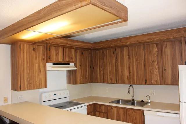 a kitchen with a sink and cabinets