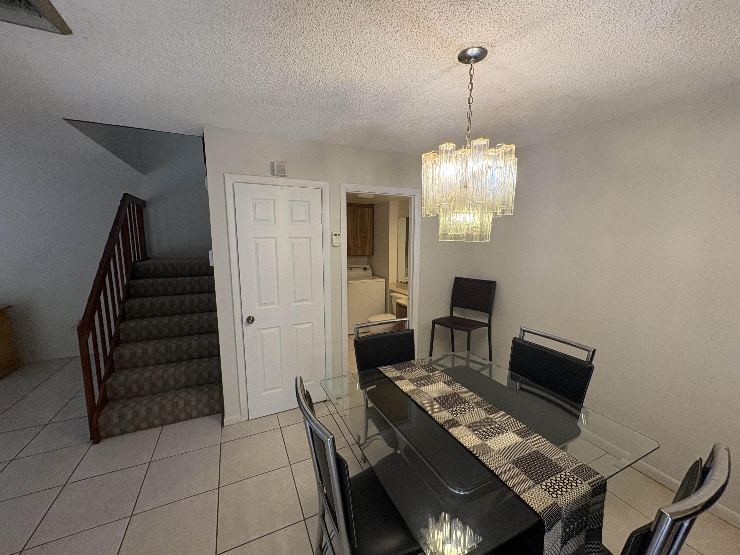 2950 Southwest 22nd Circle, Unit 4A Delray Beach, FL 33445 - Photo 10 of 42 a workspace with furniture and window