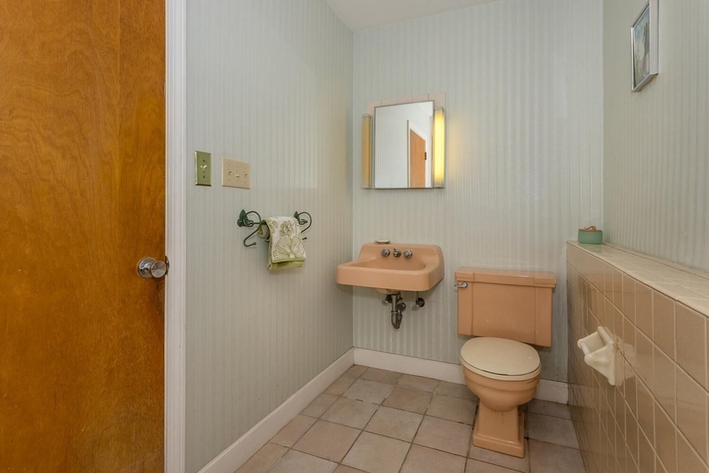 6 Mohawk Road Canton, MA 02021 - Photo 17 of 23 a white toilet sitting next to a bathroom sink