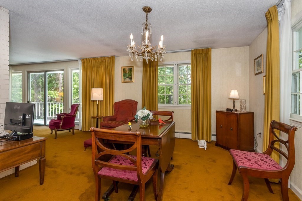 6 Mohawk Road Canton, MA 02021 - Photo 4 of 23 a living room with furniture and a chandelier