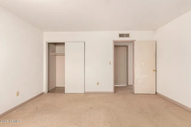 an empty room with closet