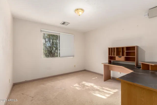 a workspace with furniture and window