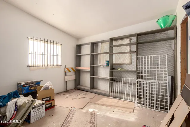 a room with a furniture and a window