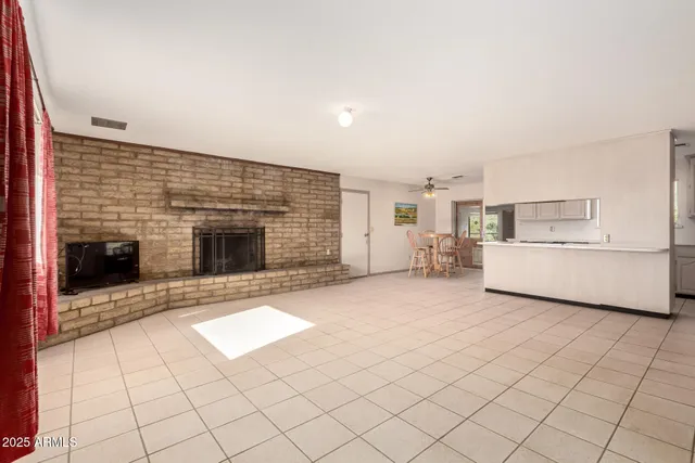 a view of a house with a wooden fence