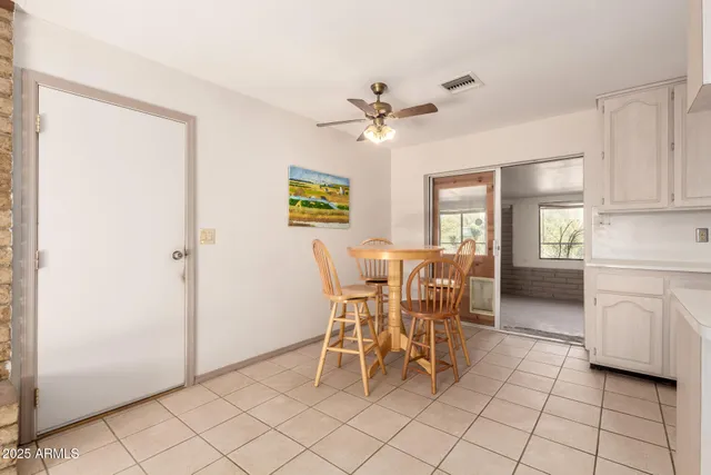a view of a livingroom with an empty space and a window
