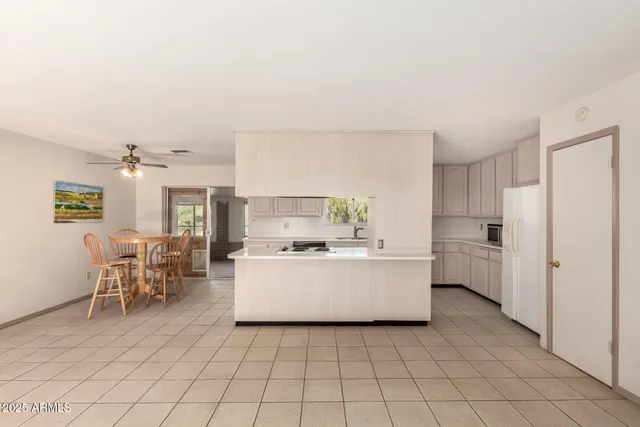 a view of kitchen with furniture and window