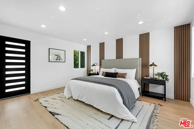 a bathroom with double vanity sink and a mirror