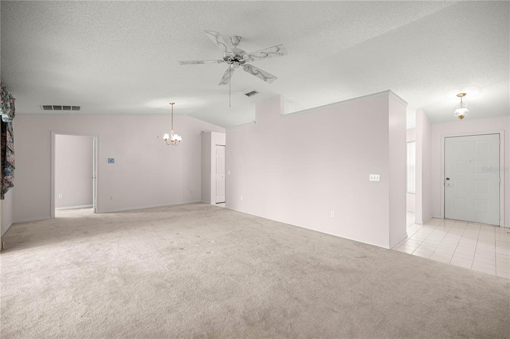 8485 Southwest 60th Circle Ocala, FL 34476 - Photo 11 of 22 en empty room with a ceiling fan and a window