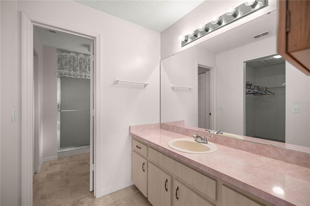 8485 Southwest 60th Circle Ocala, FL 34476 - Photo 18 of 22 a bathroom with a sink and a mirror