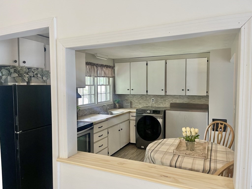 529 Howard Street Brockton, MA 02302 - Photo 18 of 34 a kitchen with stainless steel appliances granite countertop a refrigerator and stove