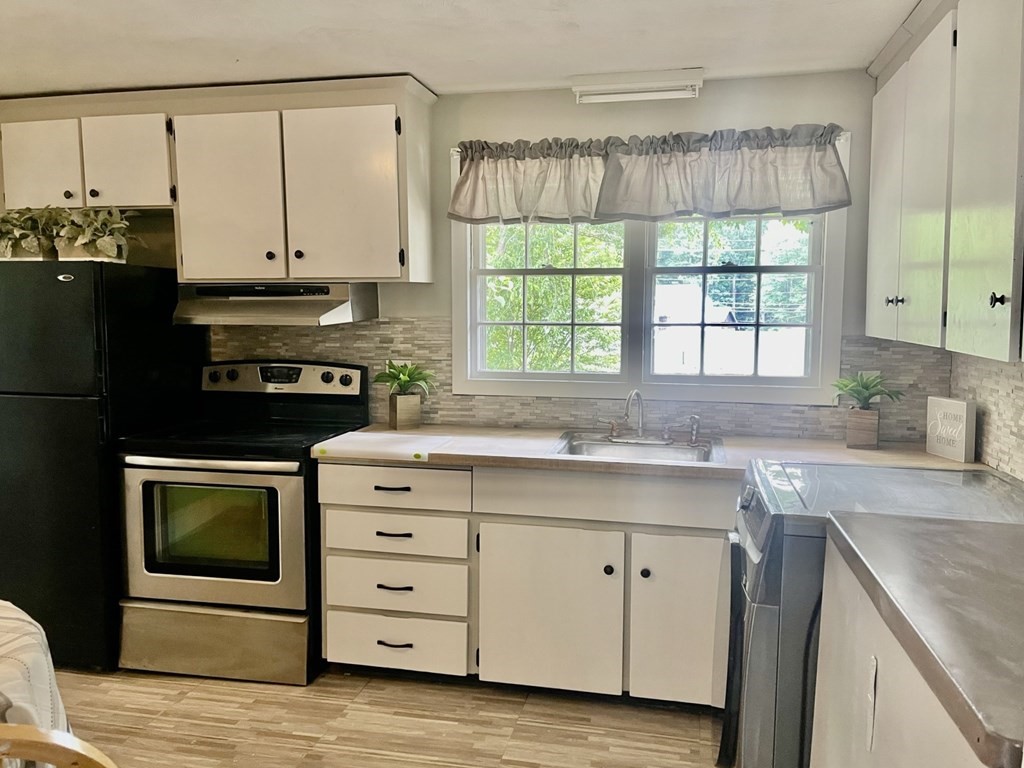529 Howard Street Brockton, MA 02302 - Photo 20 of 34 a kitchen with a stove oven and sink