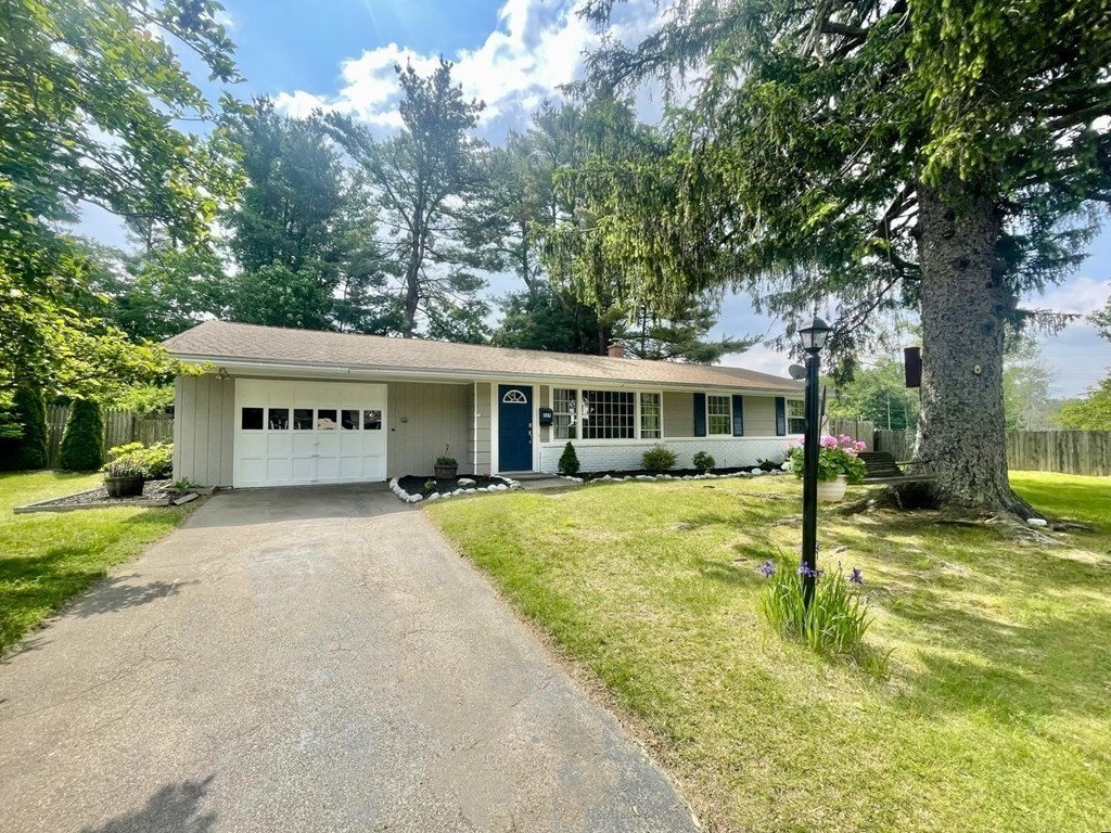529 Howard Street Brockton, MA 02302 - Photo 2 of 34 a front view of a house with a garden