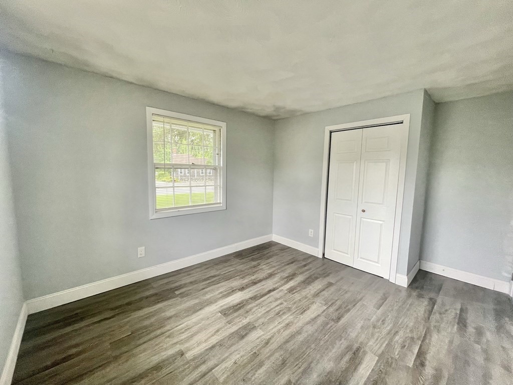 529 Howard Street Brockton, MA 02302 - Photo 25 of 34 a view of an empty room with wooden floor and a window