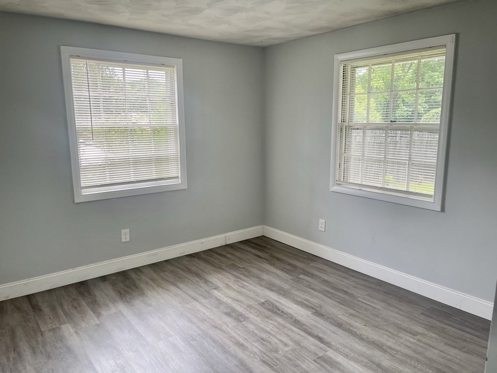 529 Howard Street Brockton, MA 02302 - Photo 26 of 34 a view of an empty room with wooden floor and a window