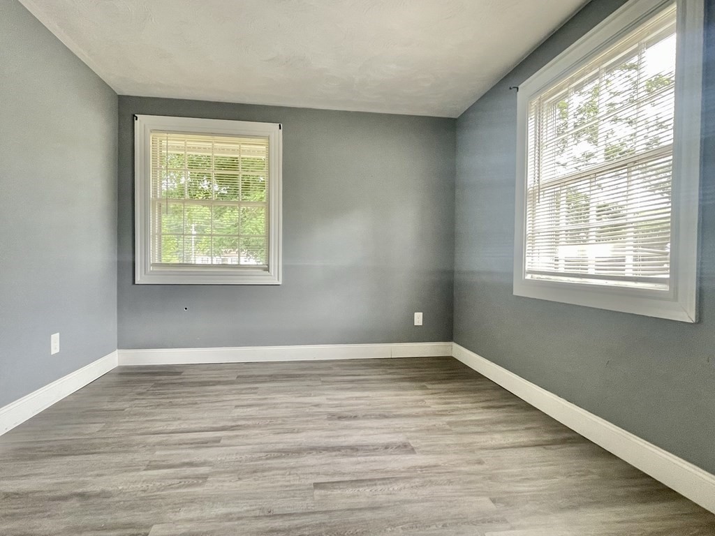 529 Howard Street Brockton, MA 02302 - Photo 27 of 34 a view of an empty room with wooden floor and a window