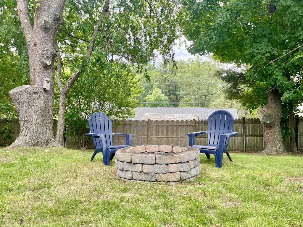 529 Howard Street Brockton, MA 02302 - Photo 32 of 34 a view of a backyard with table and chairs and a slide