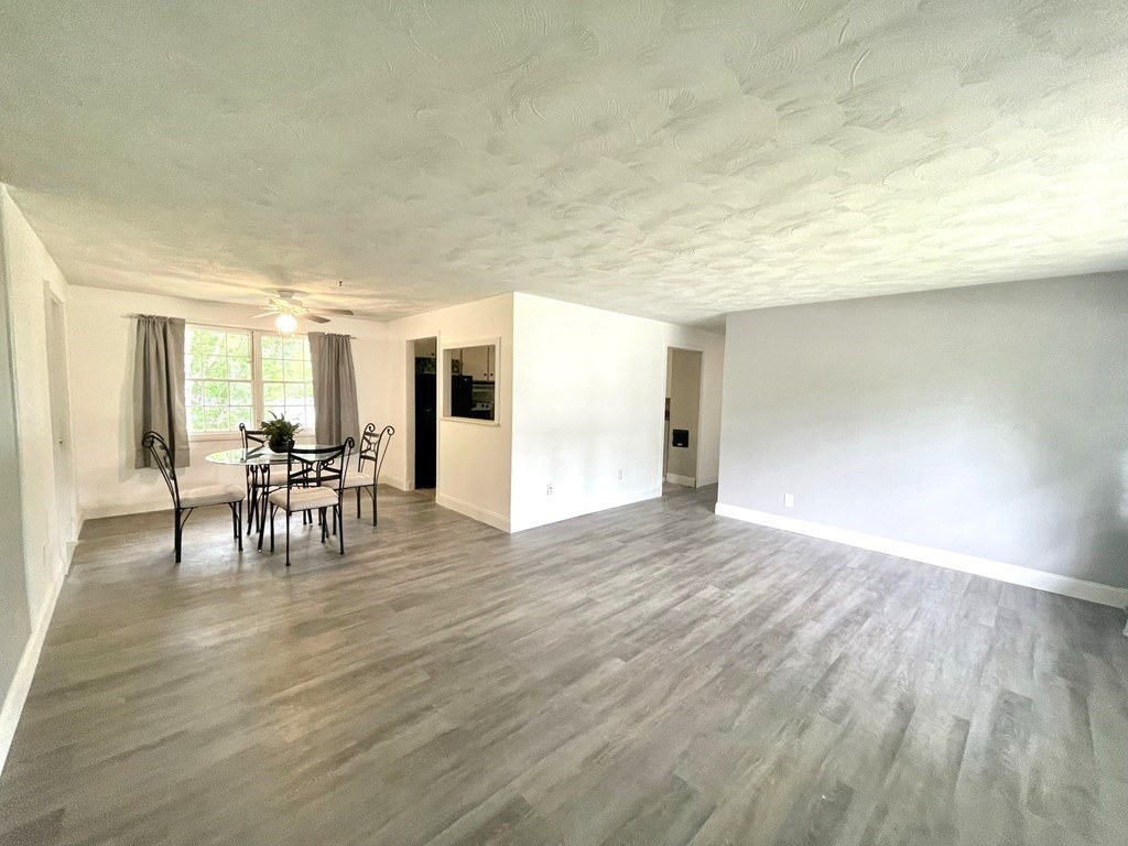 529 Howard Street Brockton, MA 02302 - Photo 7 of 34 a view of a dining room with furniture and wooden floor